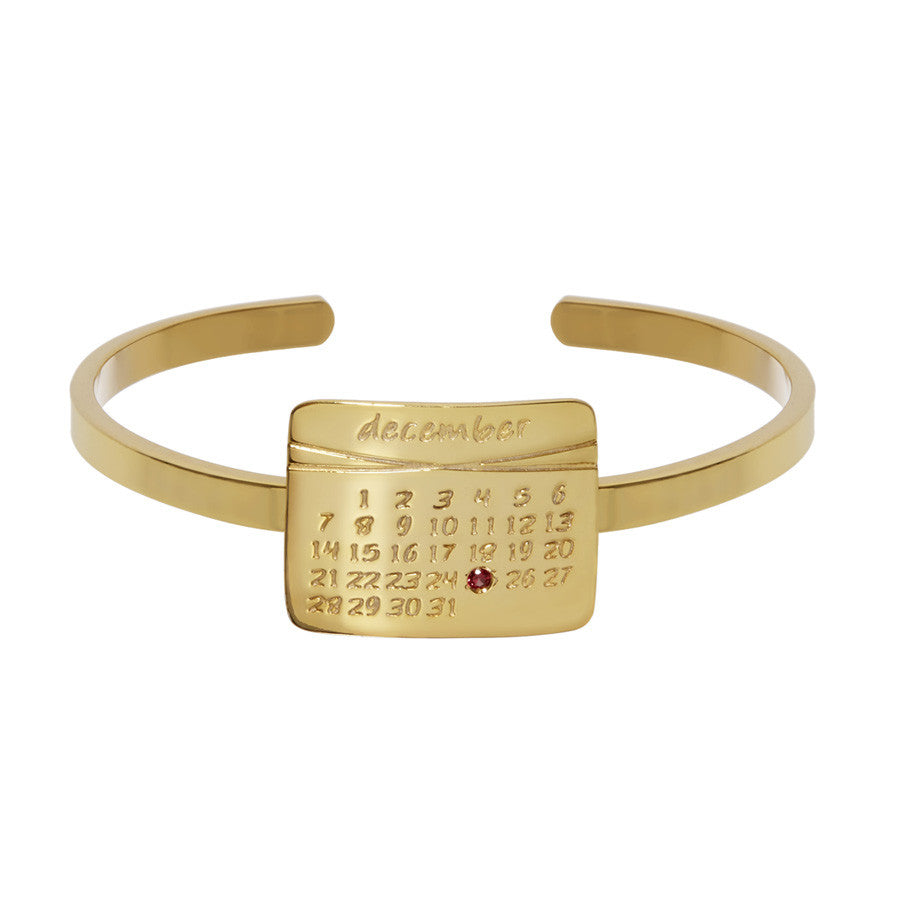 the calendar cuff bracelet<sup>®</sup> in yellow gold