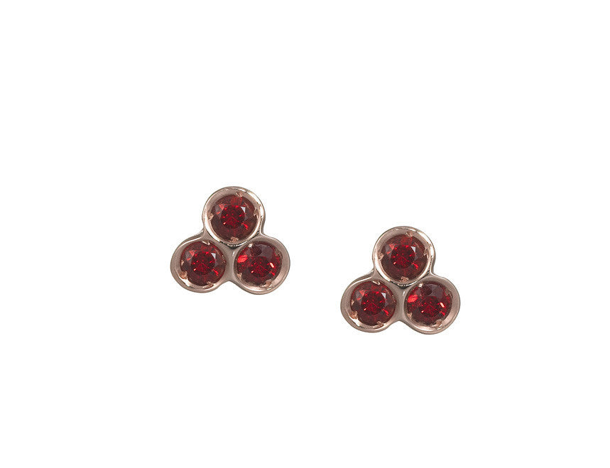 the portafortuna studs in rose gold with red sapphires
