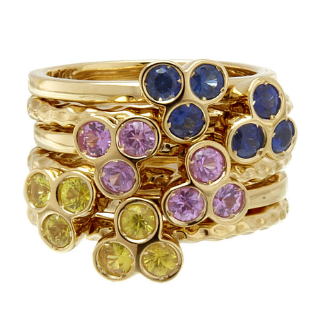 the portafortuna stacking rings in yellow gold with yellow sapphires